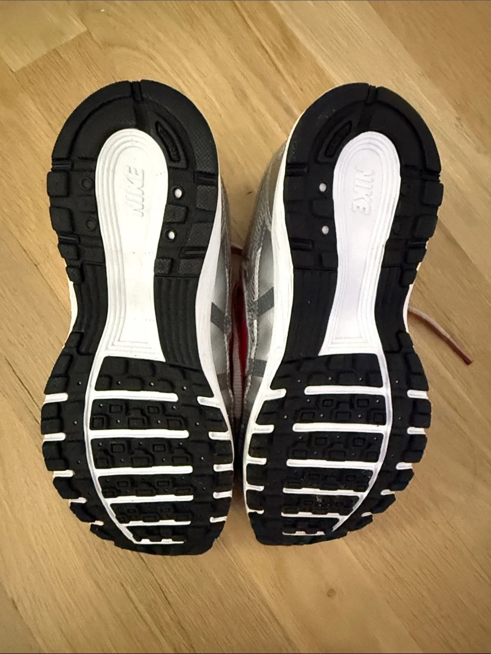 Nike Kids Silver Sneakers with Red Swoosh
